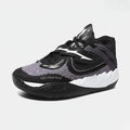 Creed Pro court shoe in black, white and pink, side view.